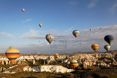 Photo for Blue sky filled multi color hot air balloons - Royalty Free Image