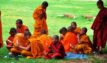 Photo for Buddha monks eating Ice creams - Royalty Free Image