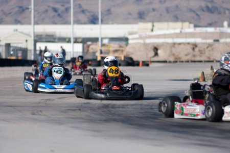 Photo for Teenager racing on go kart, junior league - Royalty Free Image