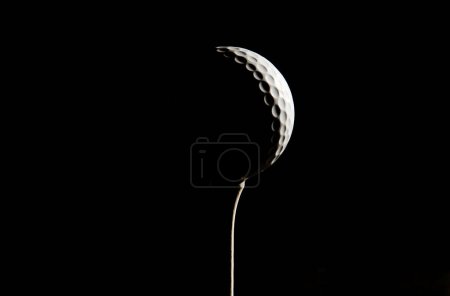 Golf ball on dark background 