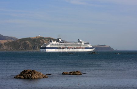 Photo for Ship Millennium passing Pencarrow Head - Royalty Free Image