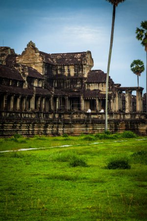 Photo for Nuns meditate on the ruin of Angkor Wat at sunrise - Royalty Free Image