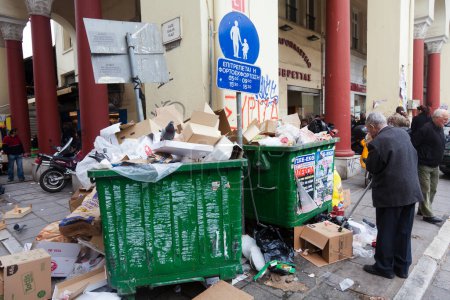 Photo for Piles of garbage on the streets due to fulls garbage bins. Incivility, rudeness and dirt. Bergamo, ITALY - October 15, 2018 - Royalty Free Image