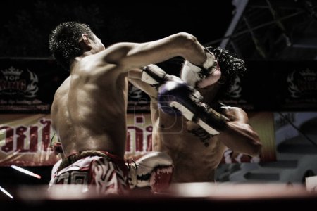 Photo for Two Shirtless Muscular Man Fighting Kick Boxing Combat In Boxing Ring - Royalty Free Image
