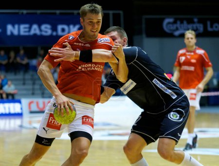 Photo for Aalborg Handball played their first league match after being detached from the AaB A/S company, winning 30 - 25 against Nordsjlland Handball. 7th September 2011 - Royalty Free Image