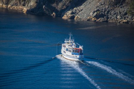Photo for Sagasund boat sailing through the ringdalsfjord - Royalty Free Image