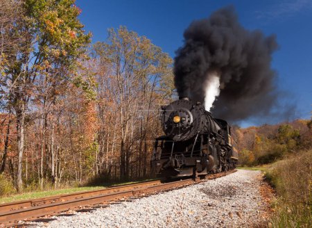 Photo for WM Steam train powers along railway - Royalty Free Image