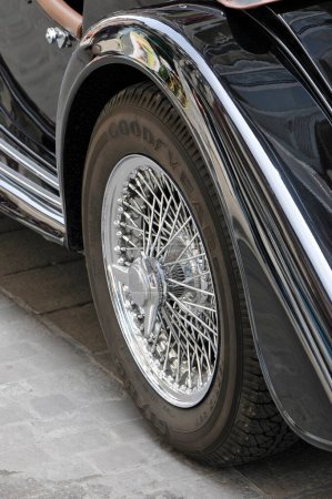 Photo for Chromed back wheel on a Morgan car - Royalty Free Image