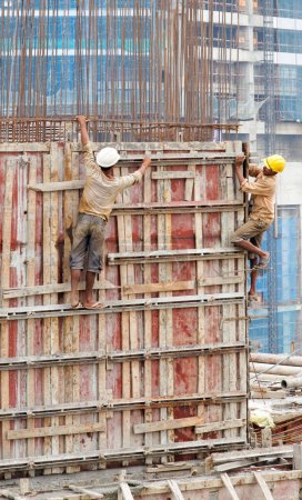 Photo for Mumbai India contraction site workers disregard personal safety - Royalty Free Image