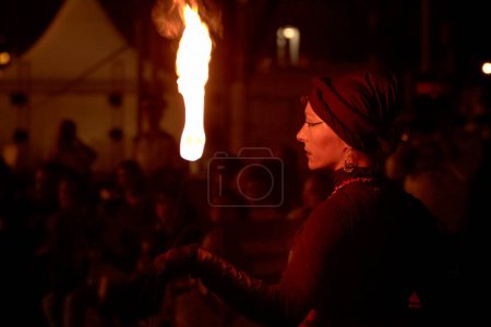 Photo for Woman doing fire ritual during show - Royalty Free Image