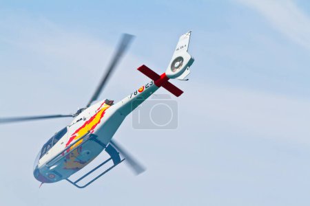 Photo for CADIZ, SPAIN-SEP 10: Helicopter of the Patrulla Aspa taking part in an test on the 3rd airshow of Cadiz on September 10, 2010 in Cadiz, Spain. - Royalty Free Image