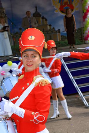 Photo for "Staraya Russa, Russia - July 9: Young drummer girl at the parade" - Royalty Free Image