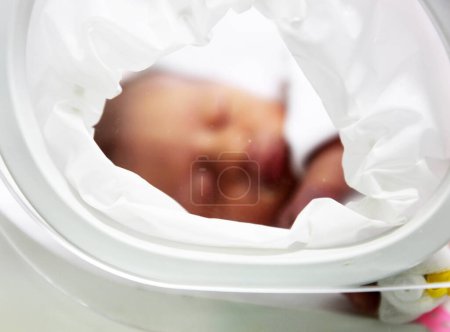 Photo for Newborn baby inside incubator - Royalty Free Image