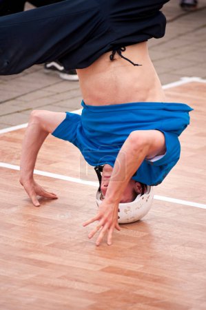 Photo for Breakdancer performing on floor. Youth Culture concept - Royalty Free Image