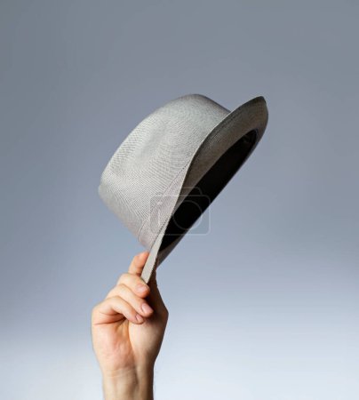 Photo for Man holding hat, close up - Royalty Free Image