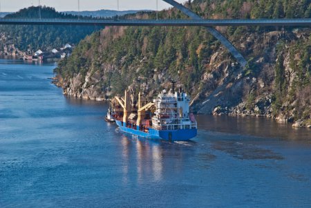 Photo for Tug herbert are towing bbc europe out of the fjord - Royalty Free Image