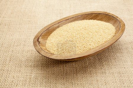 Photo for Amaranth grains in wooden bowl, close up view - Royalty Free Image