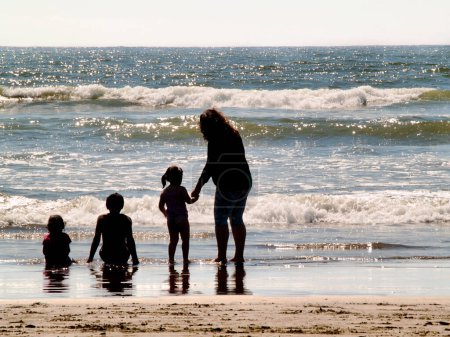 Photo for Family playing on the beach - Royalty Free Image