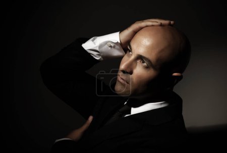 Photo for Bald man wearing black suit - Royalty Free Image