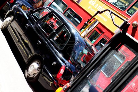 Photo for London Bus and Black Taxi Oxford Street - Royalty Free Image