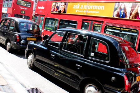 Photo for London Bus and Black Taxi Oxford Street - Royalty Free Image
