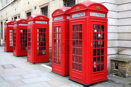 Photo for Red London Telephone Boxes on city street in Great britain - Royalty Free Image