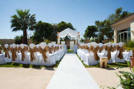 Photo for Small wedding tent in garden with chairs on lawn - Royalty Free Image