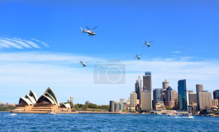 Photo for Military helicopters fly over Sydney Australia - Royalty Free Image