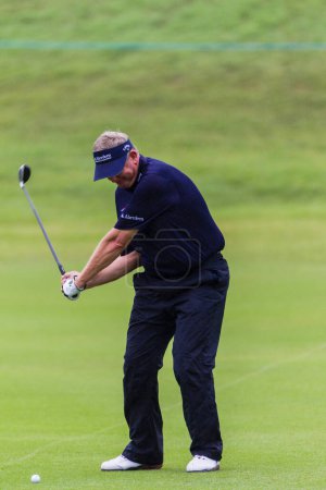 Photo for Golf Pro Colin Montgomery Swing Ball - Royalty Free Image