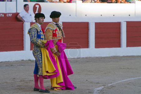 Photo for Spanish Bullfighters Morante de la Puebla and Jose Maria Manzanares with the Cape in the Bullfight, Linares, Jaen, Spain - Royalty Free Image