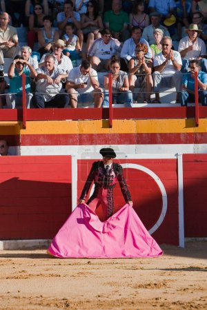 Photo for Spanish bullfighter with the cape in the bullring, Spain - Royalty Free Image