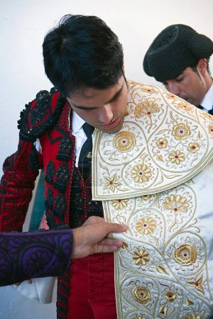 Photo for The spanish bullfighter Salvador Vega getting dressed for the paseillo or initial parade - Royalty Free Image