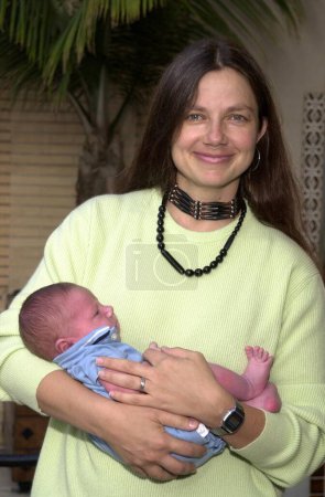 Photo for Justine Bateman and one month old son Duke at the celebrity gala honoring Producer Robert Evans for his new film "The Kid Stays In The Picture" at Barney's Greengrass, Barney's New York, Beverly Hills, Ca. 07-18-02 - Royalty Free Image