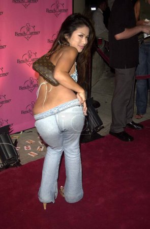 Photo for Aiko Tanaka posing from back side at Bench Warmer birthday party. September 5, 2003. Los Angeles, California, United States - Royalty Free Image