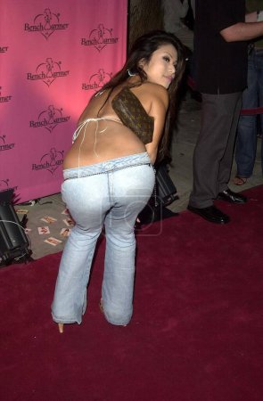 Photo for Aiko Tanaka posing from back side at Bench Warmer birthday party. September 5, 2003. Los Angeles, California, United States - Royalty Free Image