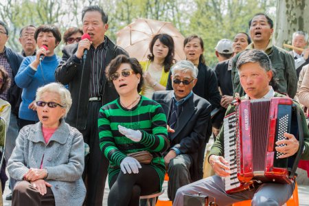 Photo for People singing revolutionary songs in fuxing park shanghai china - Royalty Free Image