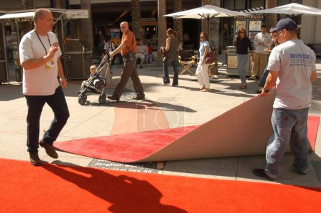 Photo for Work Crews break down the Oscar red carpet area after arrivals were cancelled due to the impending war at the Kodak Theater, where the arrivals area for the 2003 Oscars is taken down, Hollywood, CA 03-19-03 - Royalty Free Image