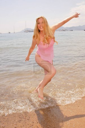 Photo for Gry Bay having fun on beach in France, Cannes - Royalty Free Image