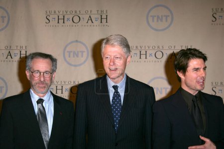 Photo for Steven Spielberg, President William Jefferson Clinton and Tom Cruise at the Fifth Annual Ambassadors For Humanity Dinner honoring Former President William J. Clinton, Universal Studios, Universal City, CA 02-17-05 - Royalty Free Image