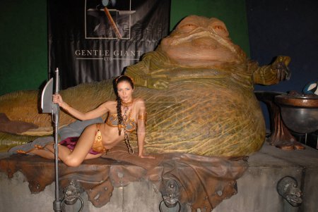 Photo for Jabba the Hutt and Adrianne Curry wearing Slave Leia costume, Star Wars characters. Gentle Giant Studios, Burbank, CA - Royalty Free Image