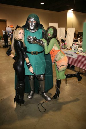 Photo for Paula Labared as and Alicia Arden from CelebrityCosplay.com with Dr. Doomat Long Beach Comic-Con Day 2, Long Beach Convention Center, Long Beach, CA. 10-30-10 - Royalty Free Image