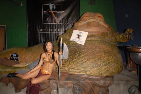 Photo for Burbank, USA - July 16, 2010: Anna Kay Akana at the Slave Leia day tour and photo shoot with Jabba the Hutt, featuring members of LeiasMetalBikini.com and CelebrityCosplay.com, Gentle Giant Studios, Burbank, CA - Royalty Free Image