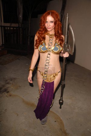 Photo for West Hollywood, USA - October 31, 2009: Phoebe Priceone of many celebrities wearing a Princess Leia Slave Girl costume from Star Wars at the Ersy Hollywood Halloween Celebration, Various Locations, West Hollywood, CA - Royalty Free Image