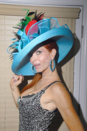 Photo for Phoebe Pricewearing Phoebe Price Designs for Del Mar Races Opening Day, Private Location, Beverly Hills, CA - Royalty Free Image