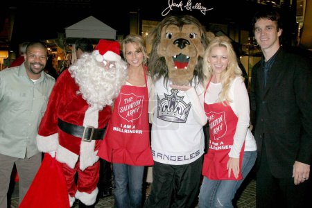 Photo for Kelly Perine and Trisha Kara with Aubrie Lemon and Luc Robitaille at The Salvation Army's Annual Kettle Kick Off Honoring Honorary Mayor Johnny Grant and Local and County Fire Chiefs. The Original Farmers Market, Los Angeles, CA. 11-19-07 - Royalty Free Image