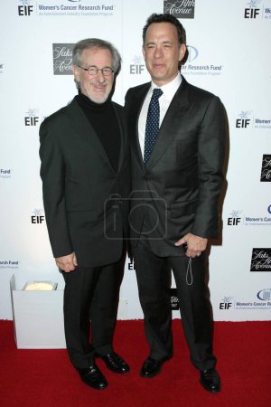 Photo for Steven Spielberg and Tom Hanks at the 14th Annual Saks Fifth Avenue's 'Unforgettable Evening' benefiting the Entertainment Industry Foundation's Women's Cancer Research Fund. Beverly Wilshire Hotel, Beverly Hills, CA. 02-10-09 - Royalty Free Image