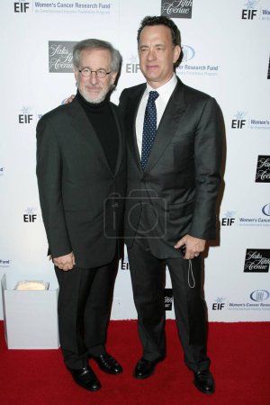 Photo for Steven Spielberg and Tom Hanks at the 14th Annual Saks Fifth Avenue's 'Unforgettable Evening' benefiting the Entertainment Industry Foundation's Women's Cancer Research Fund. Beverly Wilshire Hotel, Beverly Hills, CA. 02-10-09 - Royalty Free Image