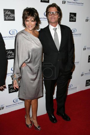 Photo for Lisa Rinna and Harry Hamlin at the 14th Annual Saks Fifth Avenue's 'Unforgettable Evening' benefiting the Entertainment Industry Foundation's Women's Cancer Research Fund. Beverly Wilshire Hotel, Beverly Hills, CA. 02-10-09 - Royalty Free Image