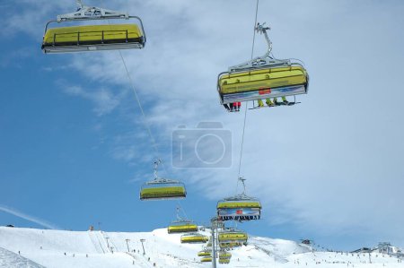 Photo for Ski lift in snowy mountains at winter - Royalty Free Image
