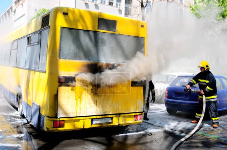 Photo for Bus on fire on the street - Royalty Free Image